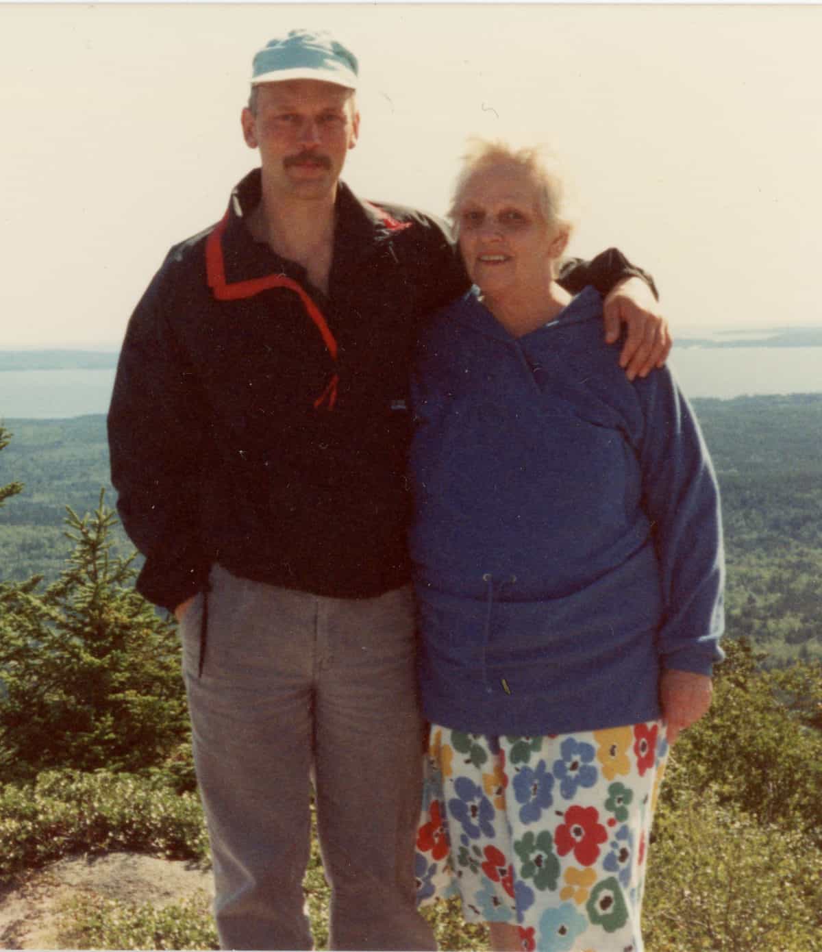 Son and mother at mountain top.